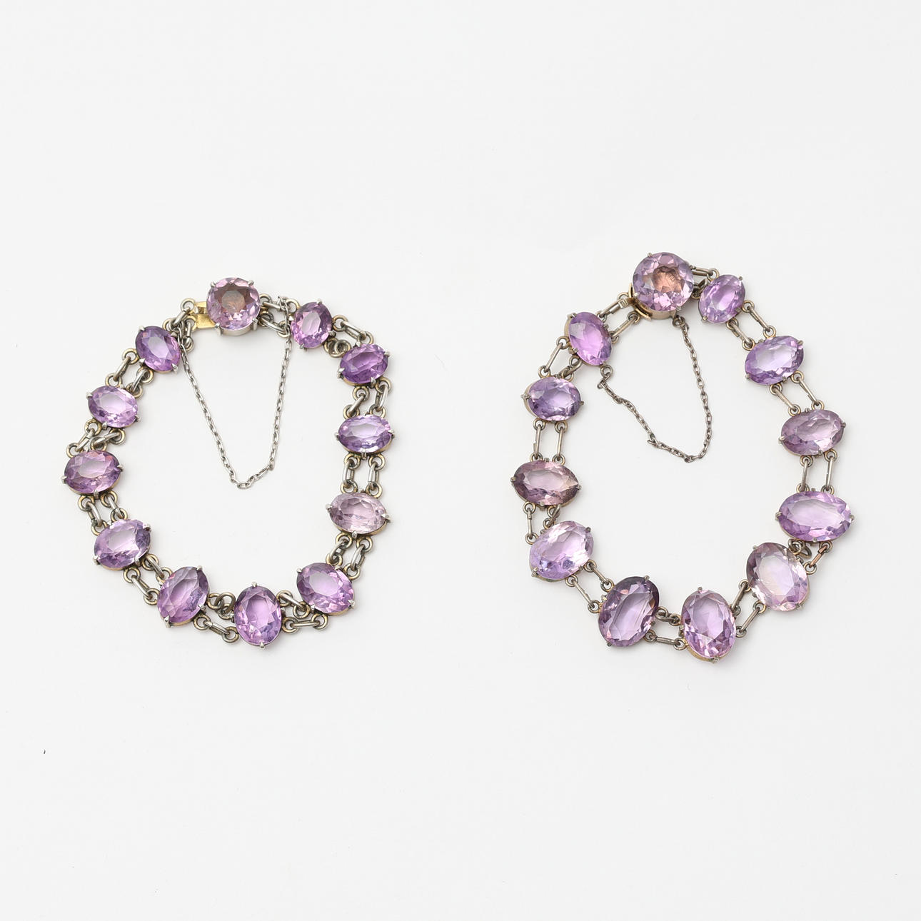 BRACELETS, two, silver and amethysts, circa 1900.