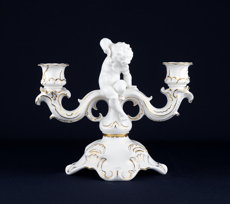 HUTSCHENREUTHER KARL TUTTER. 2-armed candlestick with putto.