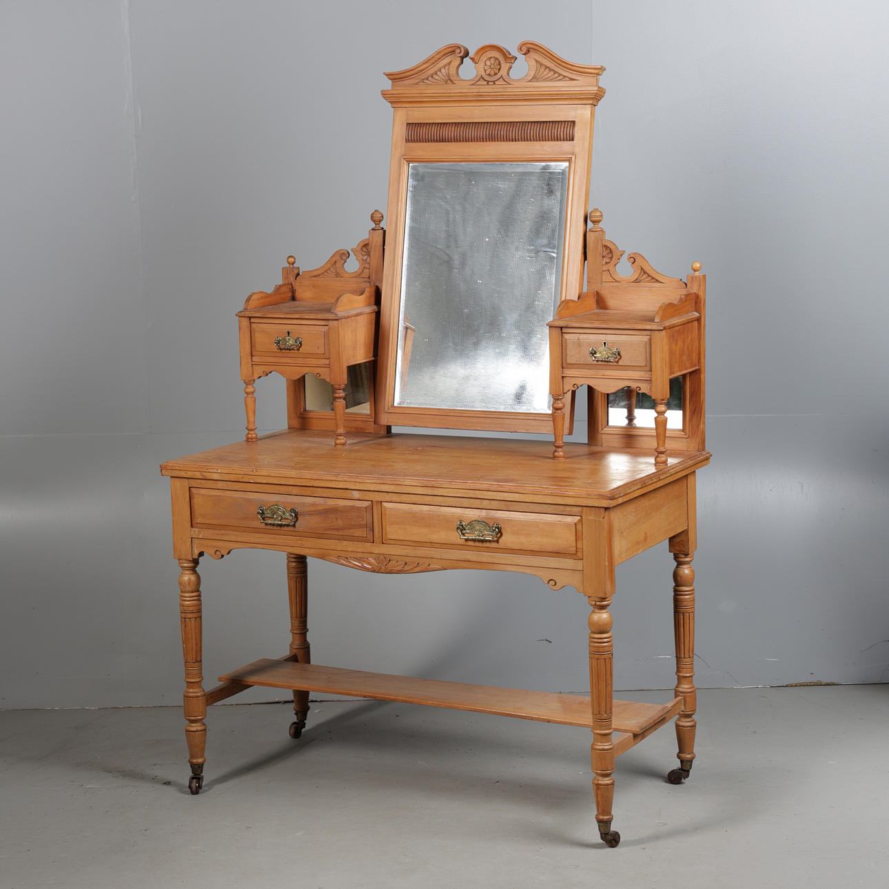 AN EDWARDIAN SATIN WALNUT DRESSING TABLE.