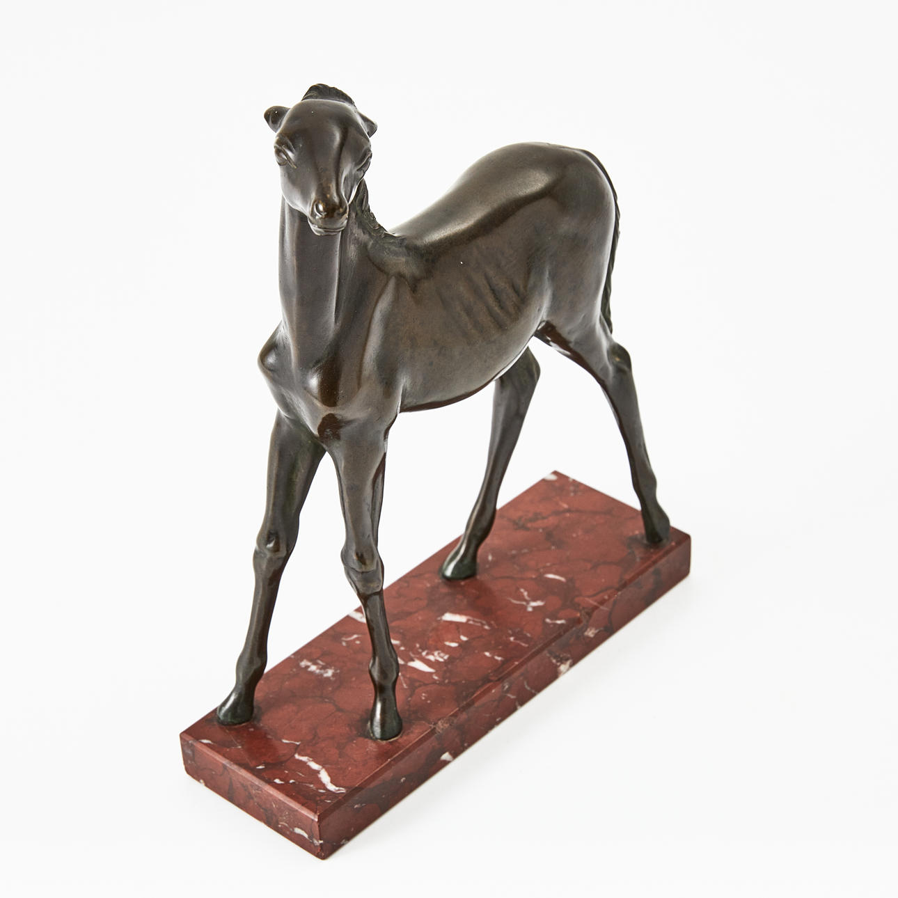 HARRY HERMAN CHRISTLIEB (USA 1886-1967) Föl, patinerat brons, sockel av sten. Märkt under sockeln Christlieb.
