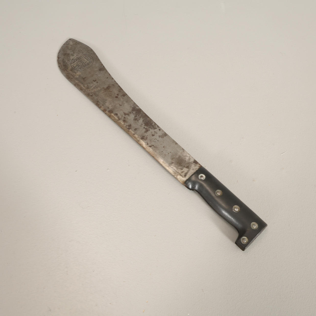 MACHETE bladet märkt 'Bolo Hand Forged'.