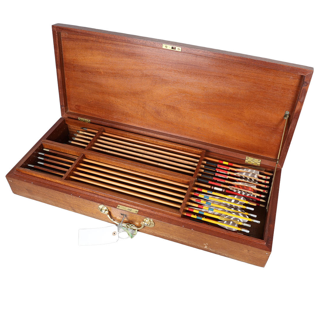 A BOXED COLLECTION OF PINE SHAFTED ARROWS.