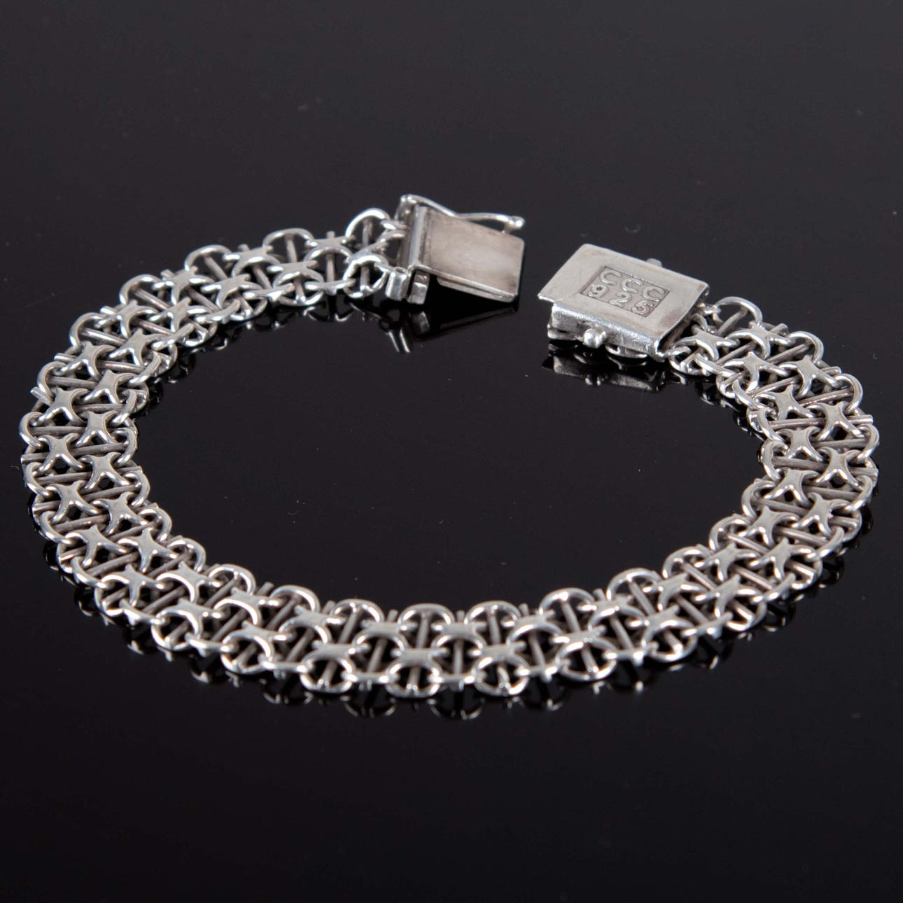 ARMBAND. X-länk, silver.