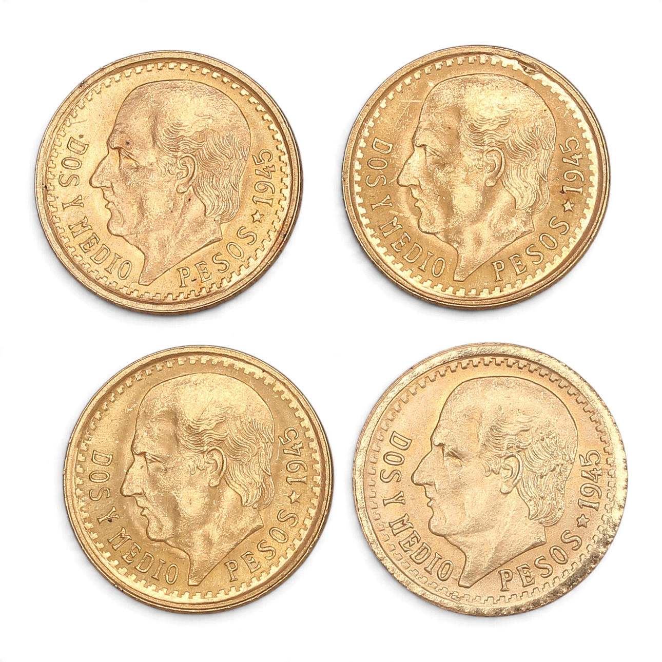 Four Mexican gold coins.