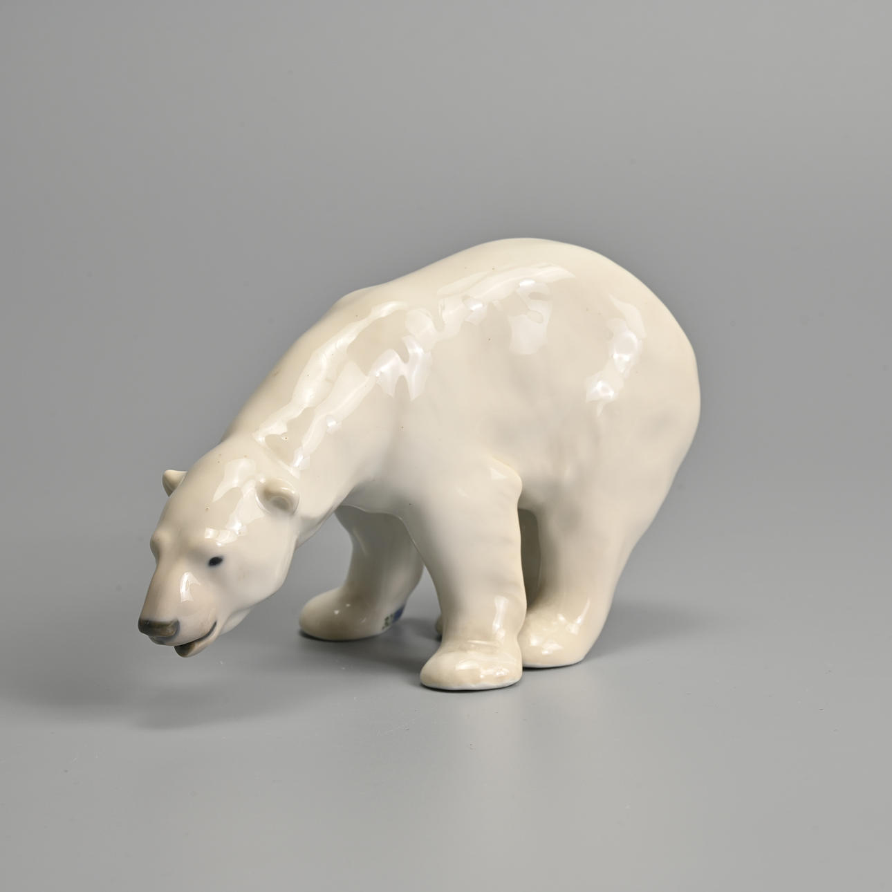 A ROYAL COPENHAGEN PORCELAIN MODEL OF A POLAR BEAR, 20TH CENTURY, BLUE ...