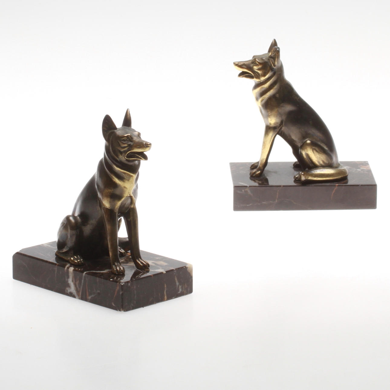 BOOK SUPPORT, a pair. Schäfer. Metal on stone plinth.