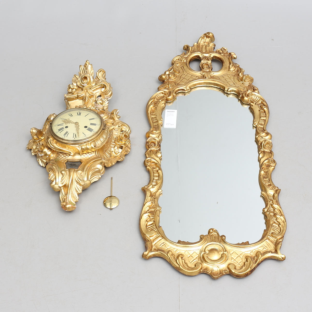 WALL PENDULUM and MIRROR, gilded, 1900s.