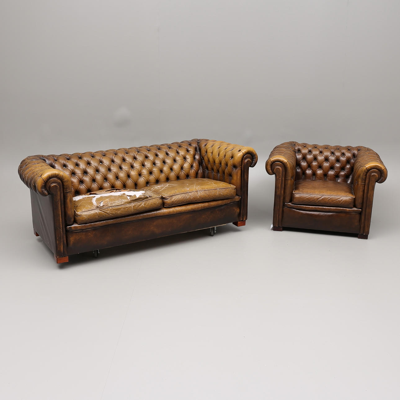 SOFA and ARMCHAIR, chesterfield, 1900s.