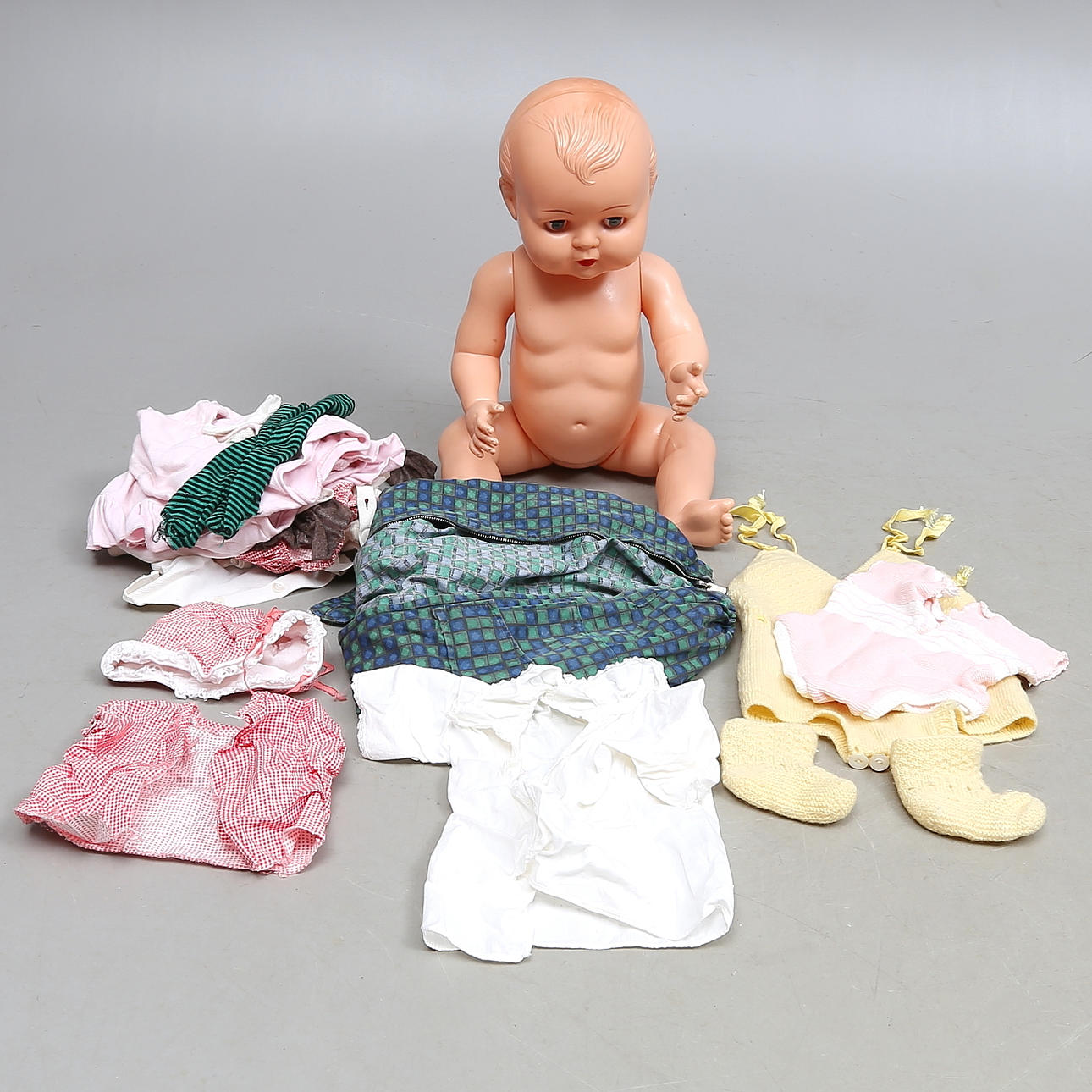 DOLL, Kader, and various doll clothes, 1900s.