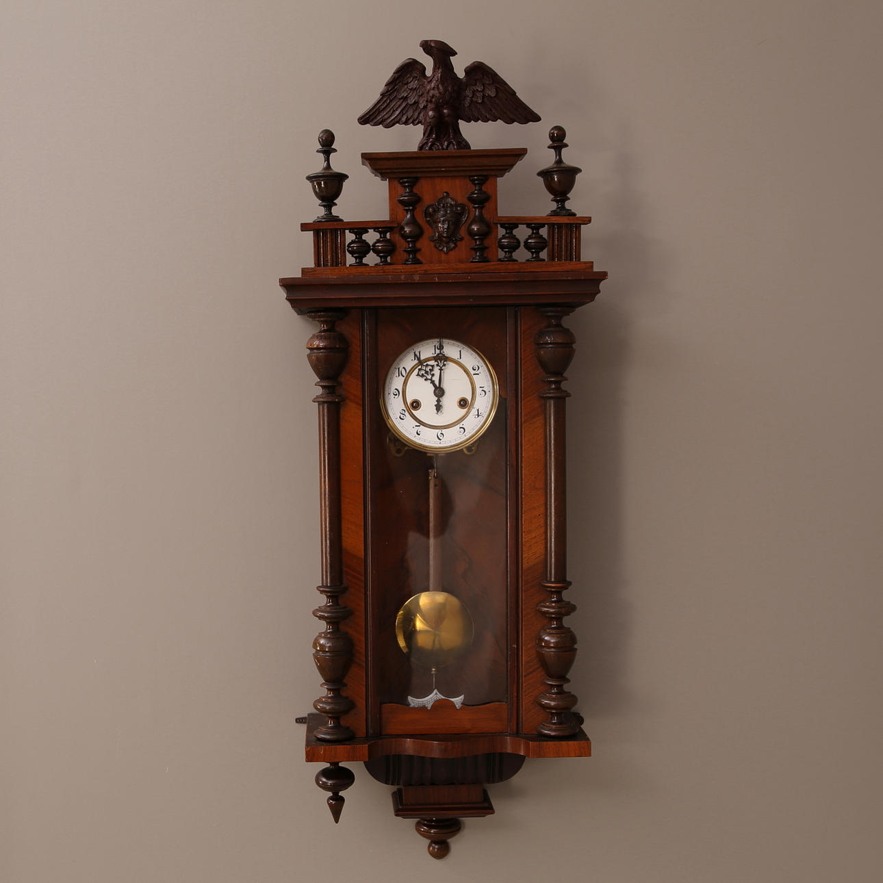 WALL PENDULUM, wooden case, dial GB, eagle decoration, 1900s.