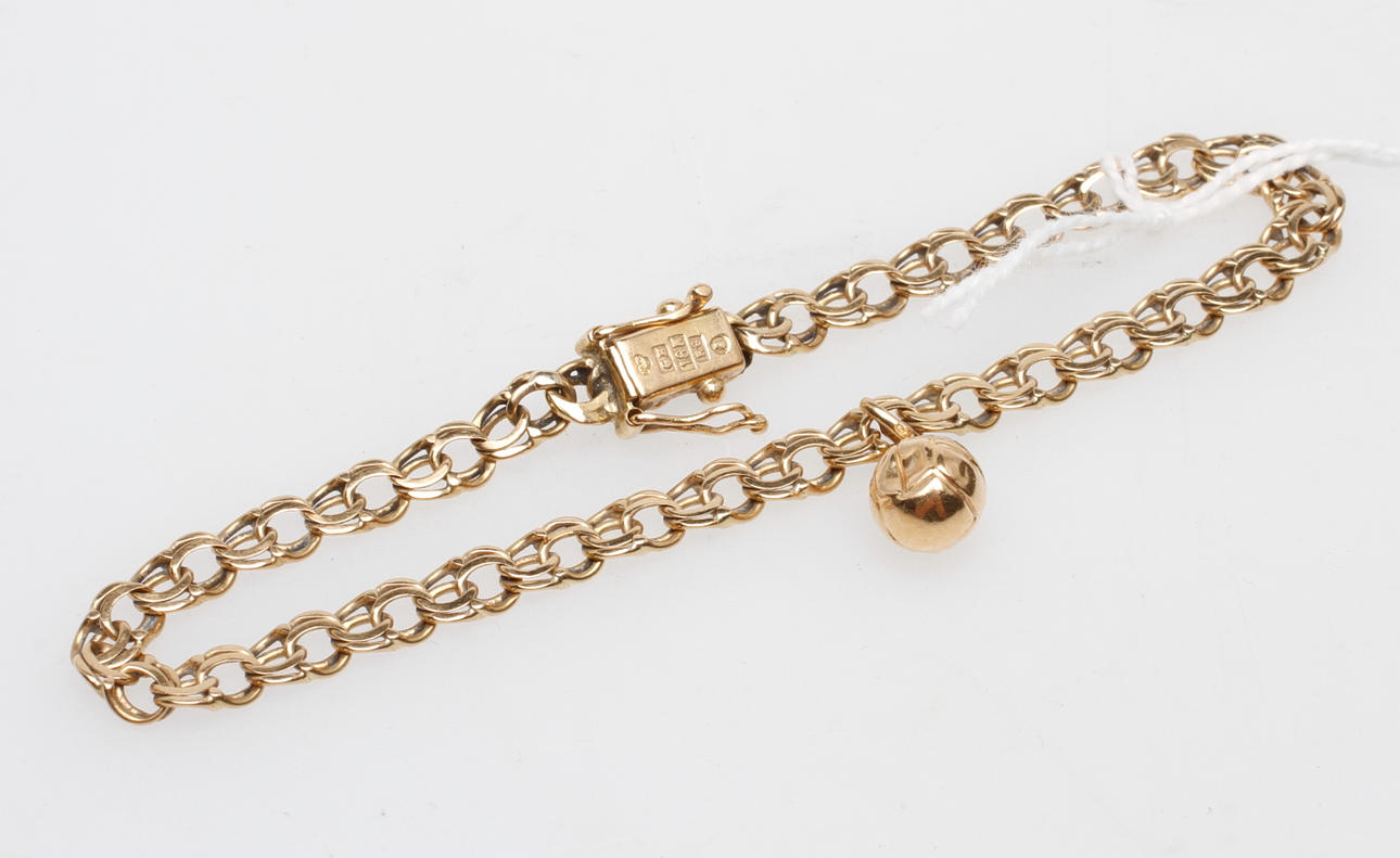 ARMBAND MED BERLOCK, 18k guld, vikt ca 9 gr.