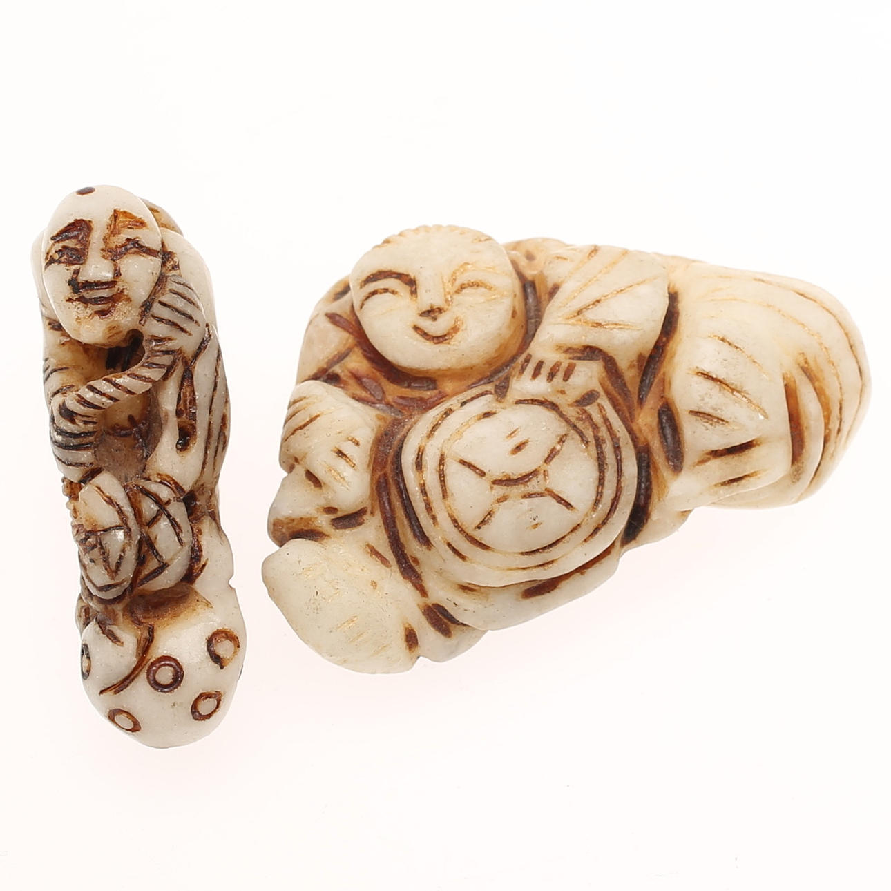 NETSUKE, 2 pieces, stone. Asia.