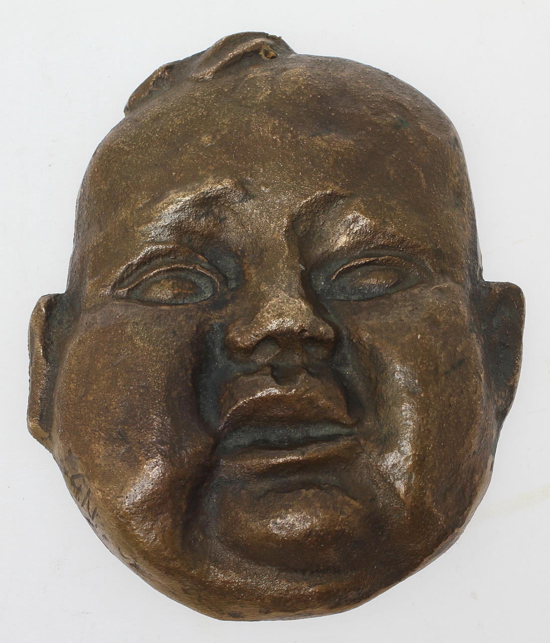 GUNNAR NILSSON. Ansiktsrelief, brons, monogramsignerad.