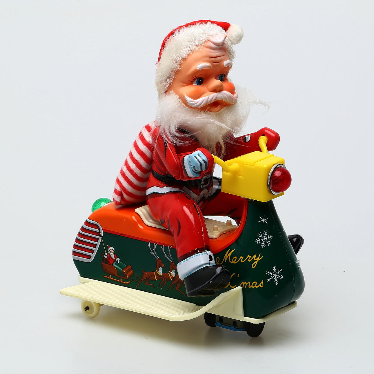 TM TOMTE på snöscooter, Japan, plast och plåt.