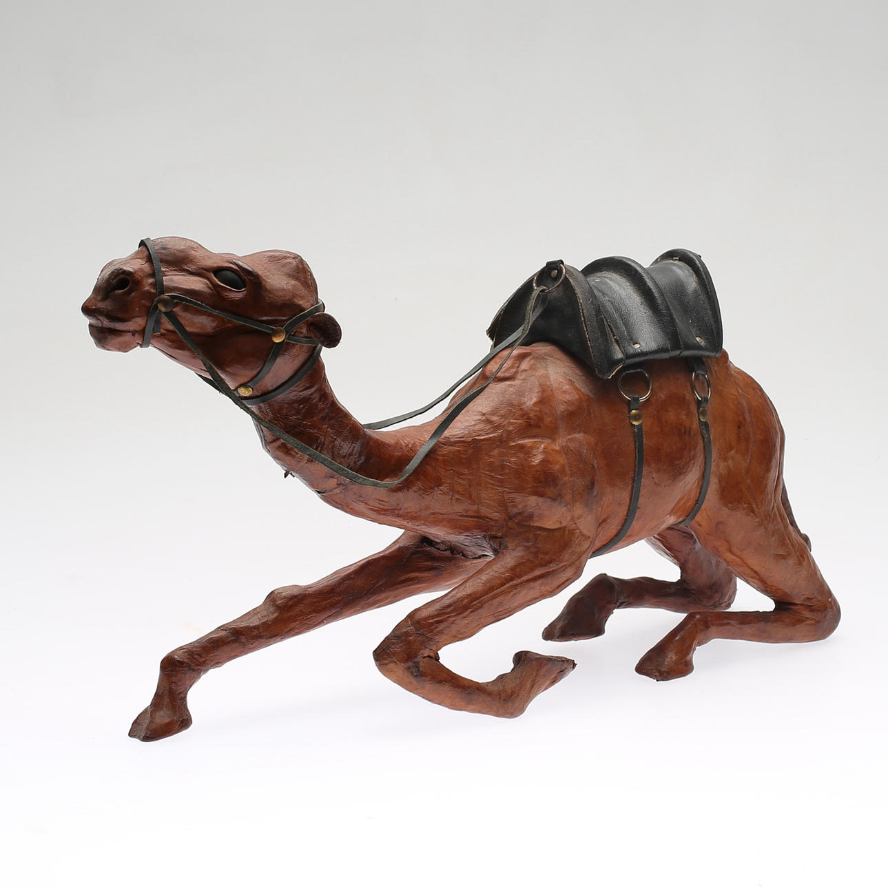 FIGURE, leather, 20th century.