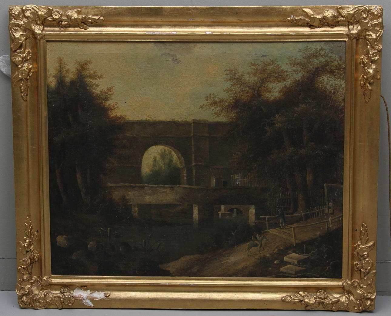 OKÄND KONSTNÄR. 1800-tal. Sydländskt landskap med flod, ryttare, figurer och bro. Osignerad.