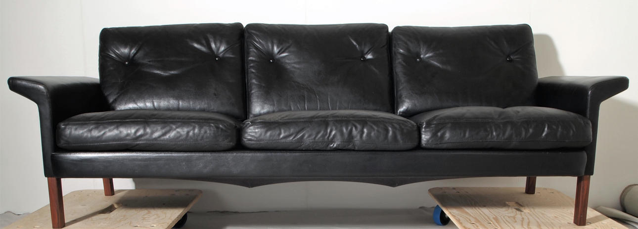 BLACK LEATHER SOFA PROBABLY IKEA.