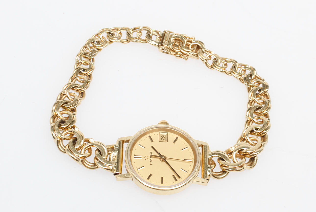 DAMARMBANDSUR ETERNA, 18k guld, total vikt ca 27 gr.