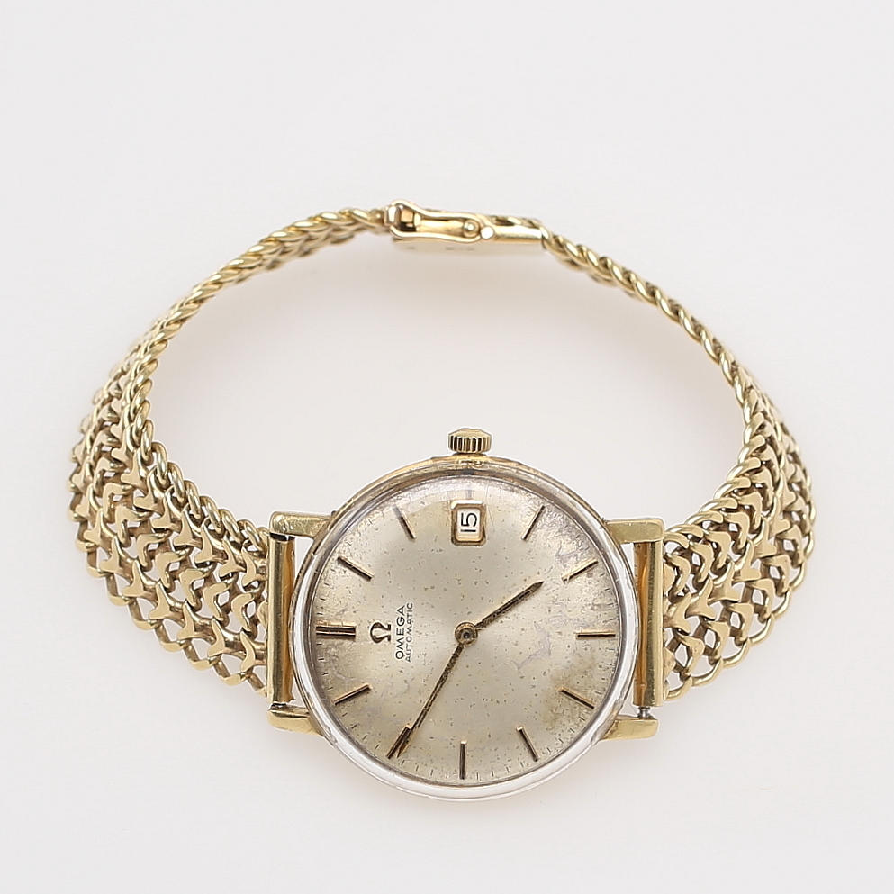 GULDKLOCKA. Omega Automatic, 18k. 1960-tal.