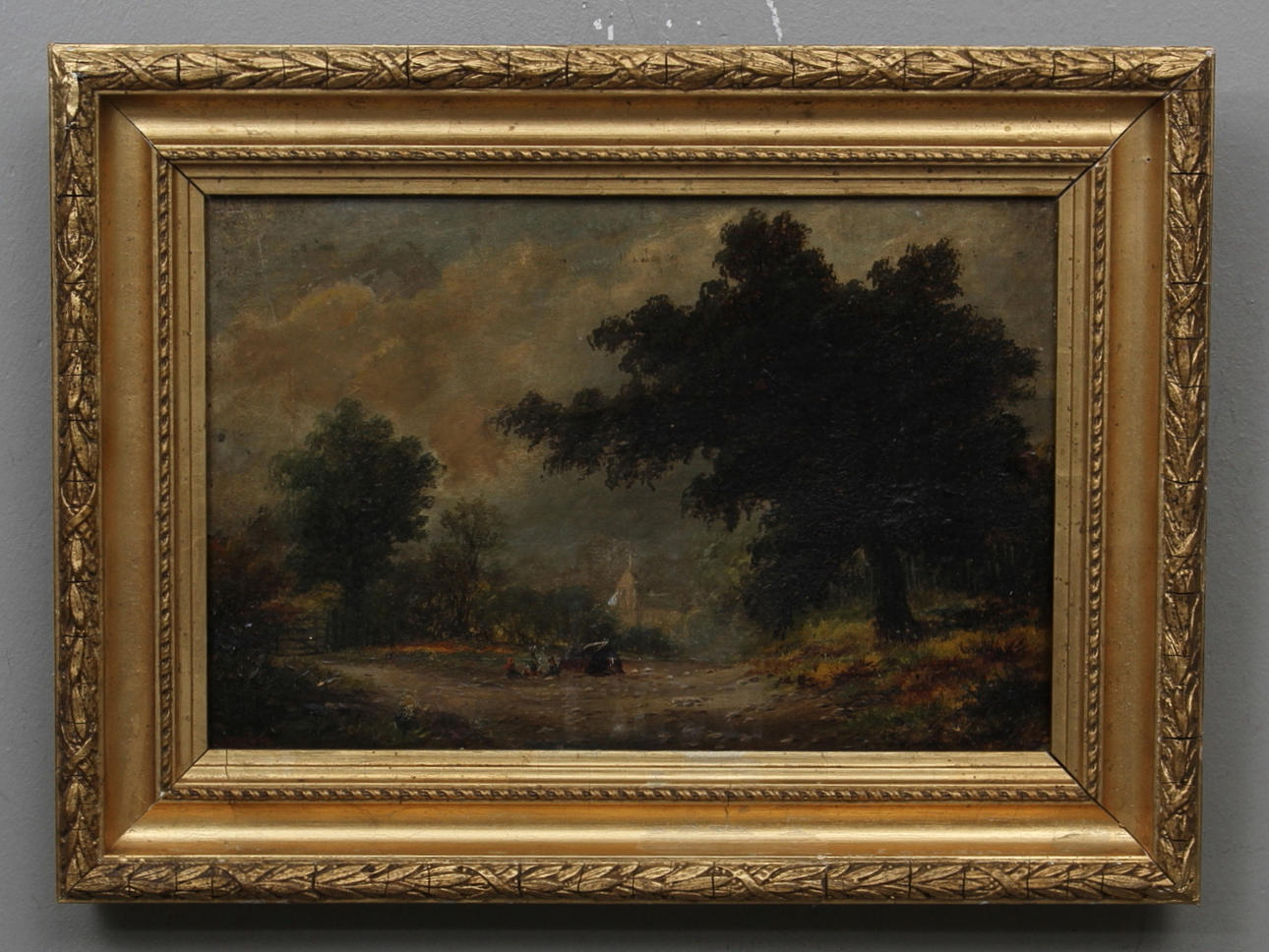 OKÄND KONSTNÄR. 1800 tal. Skogslandskap med lägereld, figurer och kyrka. Olja på duk. Otydligt signerad.