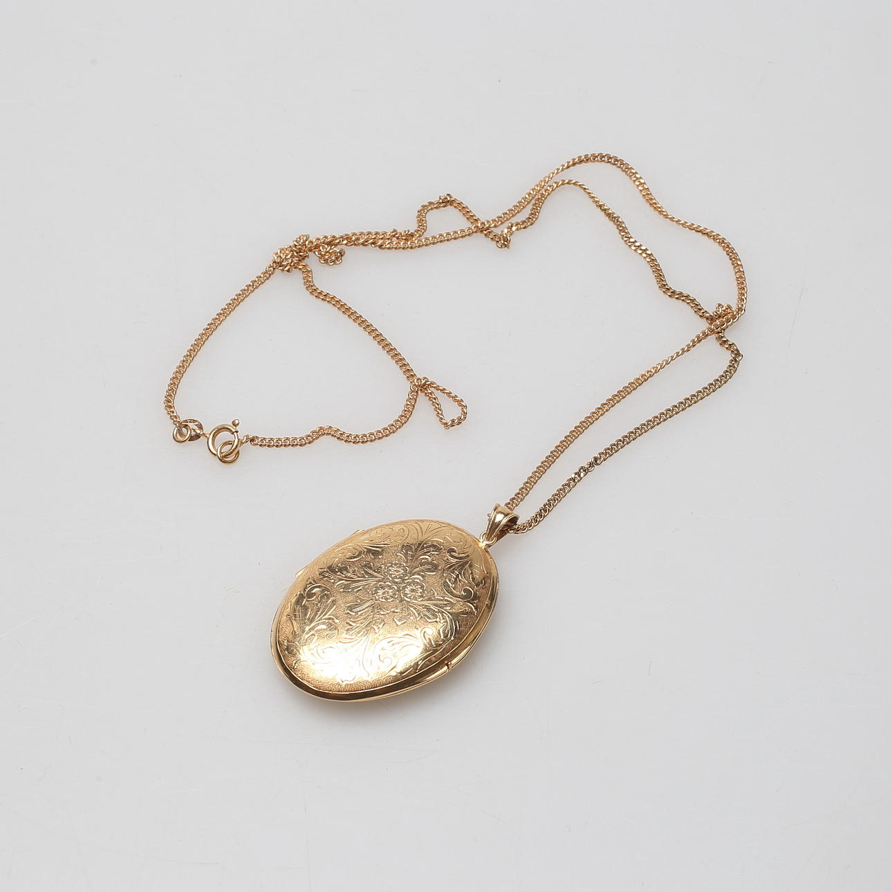 MEDALJONG, 18k guld, vikt ca 20,8 gram.