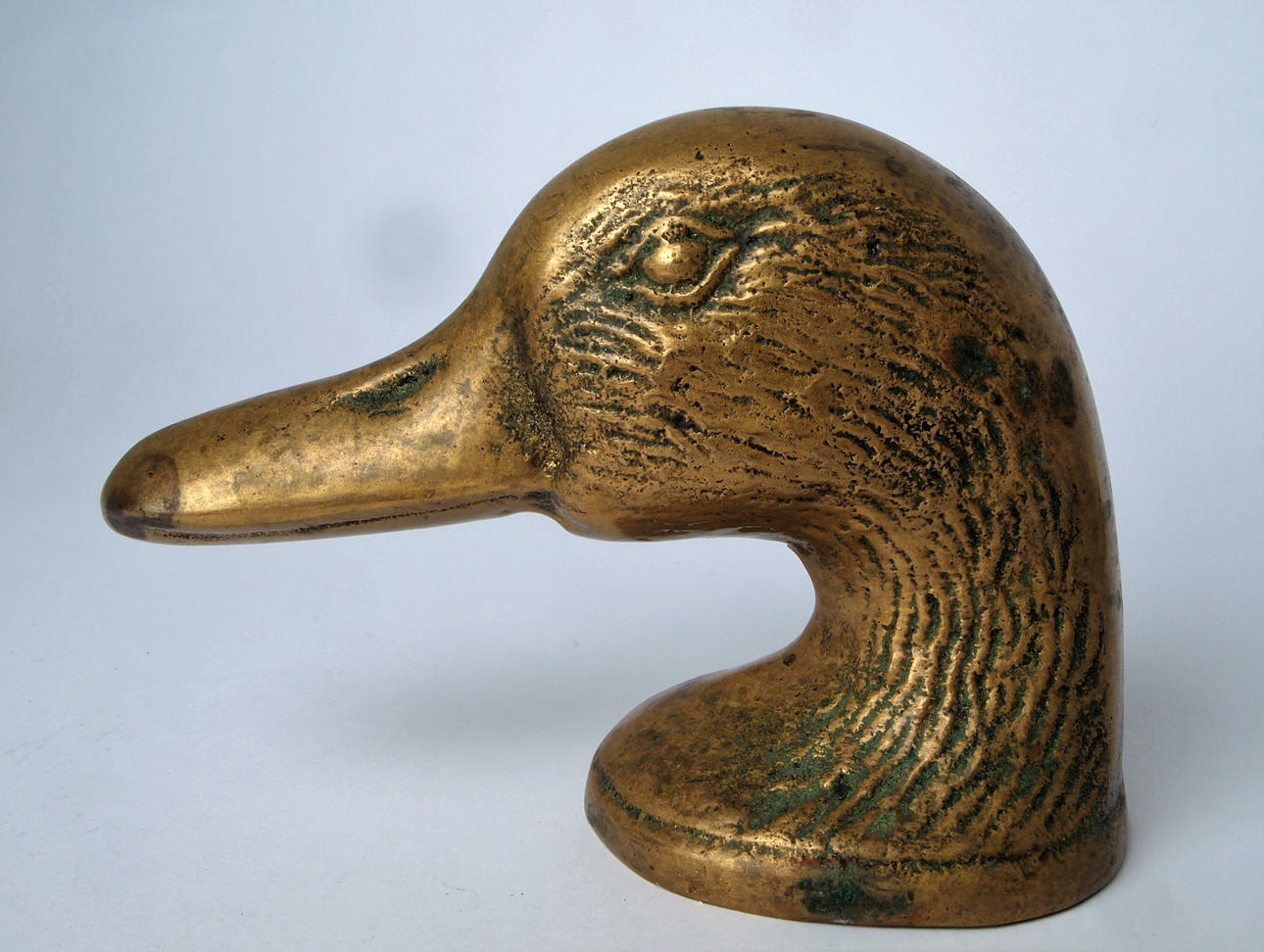 KAPSYLÖPPNARE I FORM AV ANKHUVUD.