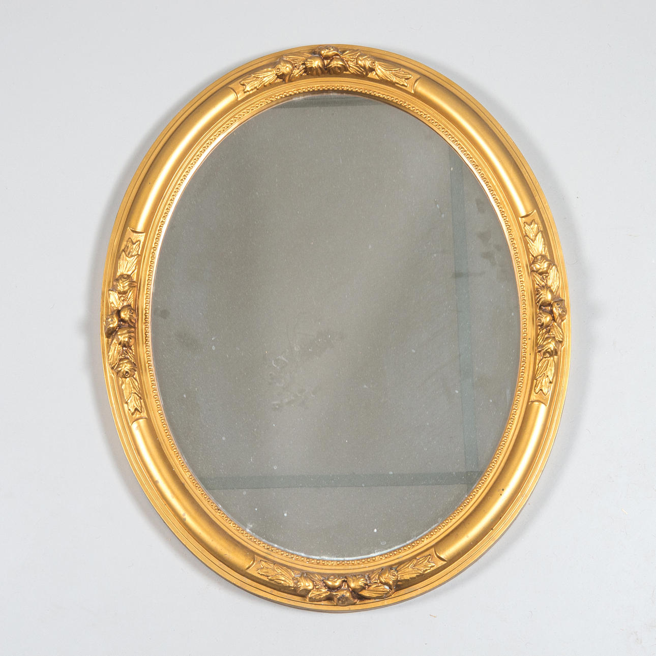 MIRROR, gilded plastic, oval, late 1900s.
