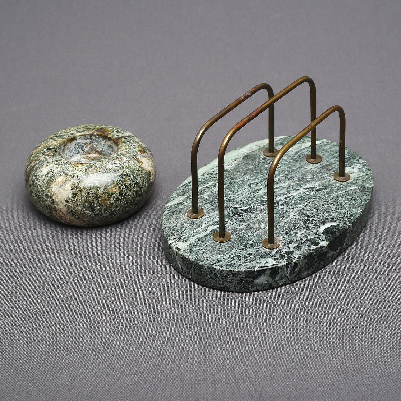 LETTER STAND and CANDLE, marble, 1900s/2000s.