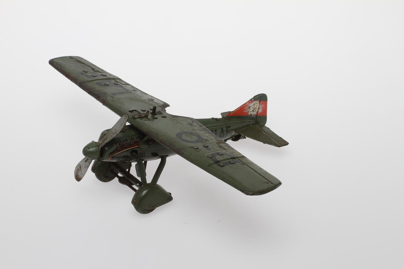TIPPCO flygplan D-OLAF, 1930-tal, litograferad plåt med bombmekanism, urverk.