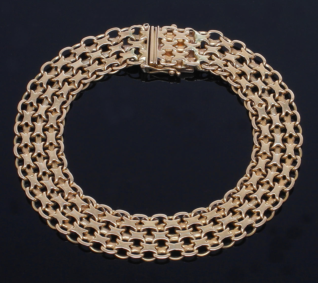 ARM LINK, 18 k gold, "X-link".