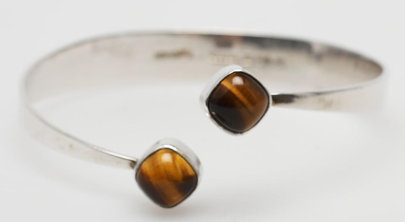 ARMRING MED TIGERÖGA, silver, formgiven av Gert Thysell, Gussi, Malmö, 1964.