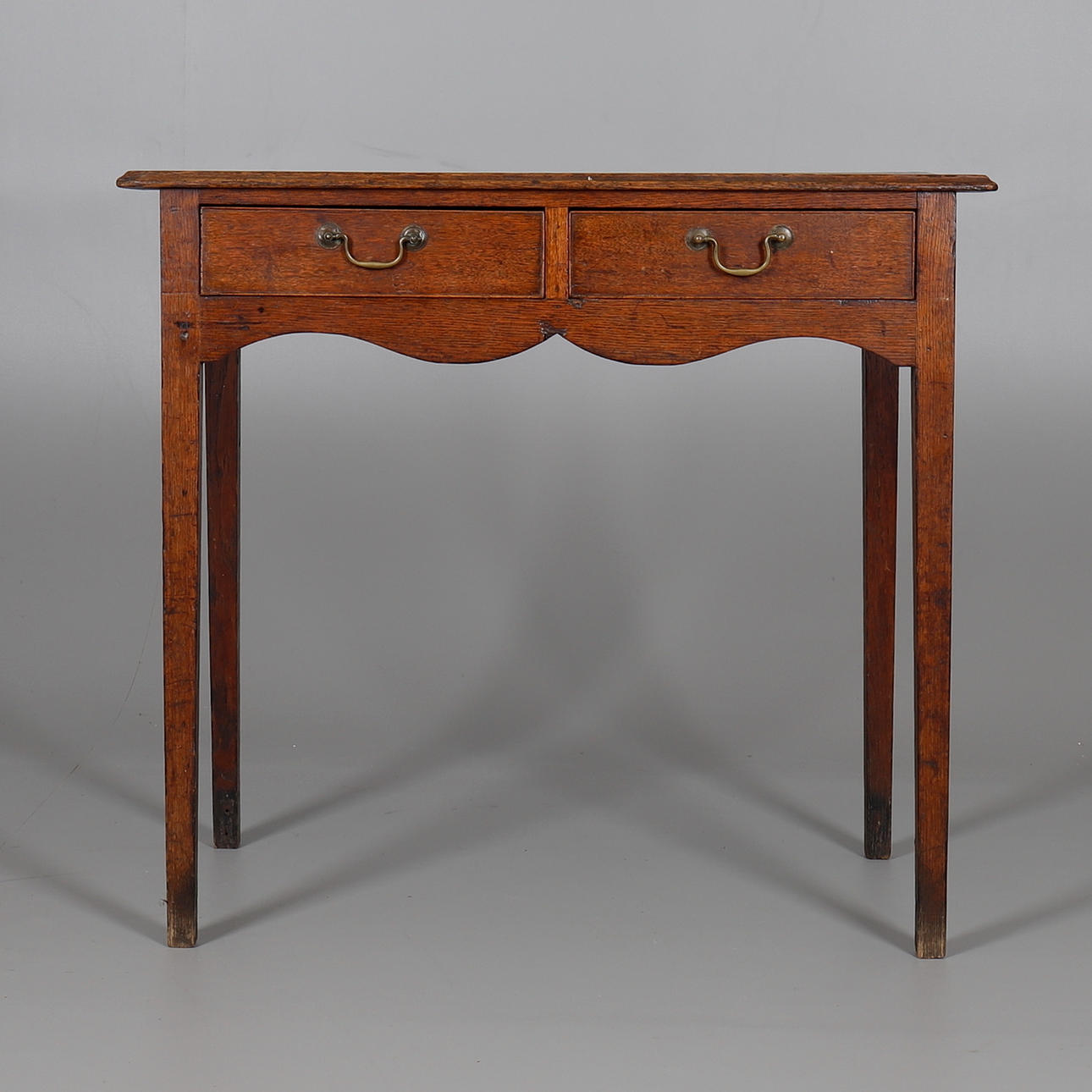 A GEORGE III OAK SIDE TABLE.