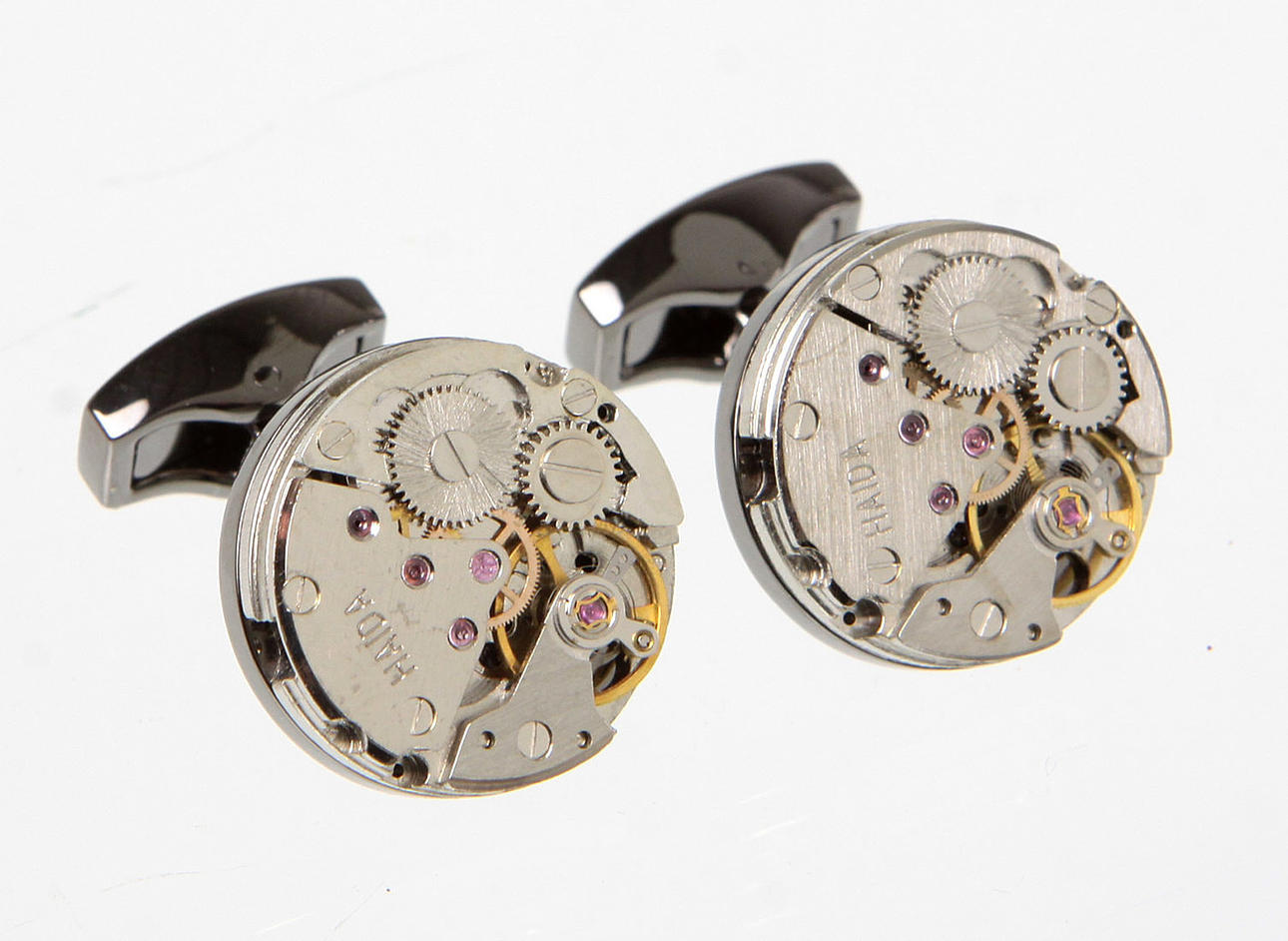 MANSCHETTENKNÖPFE, UHRWERK FORM. Katalogisierung.