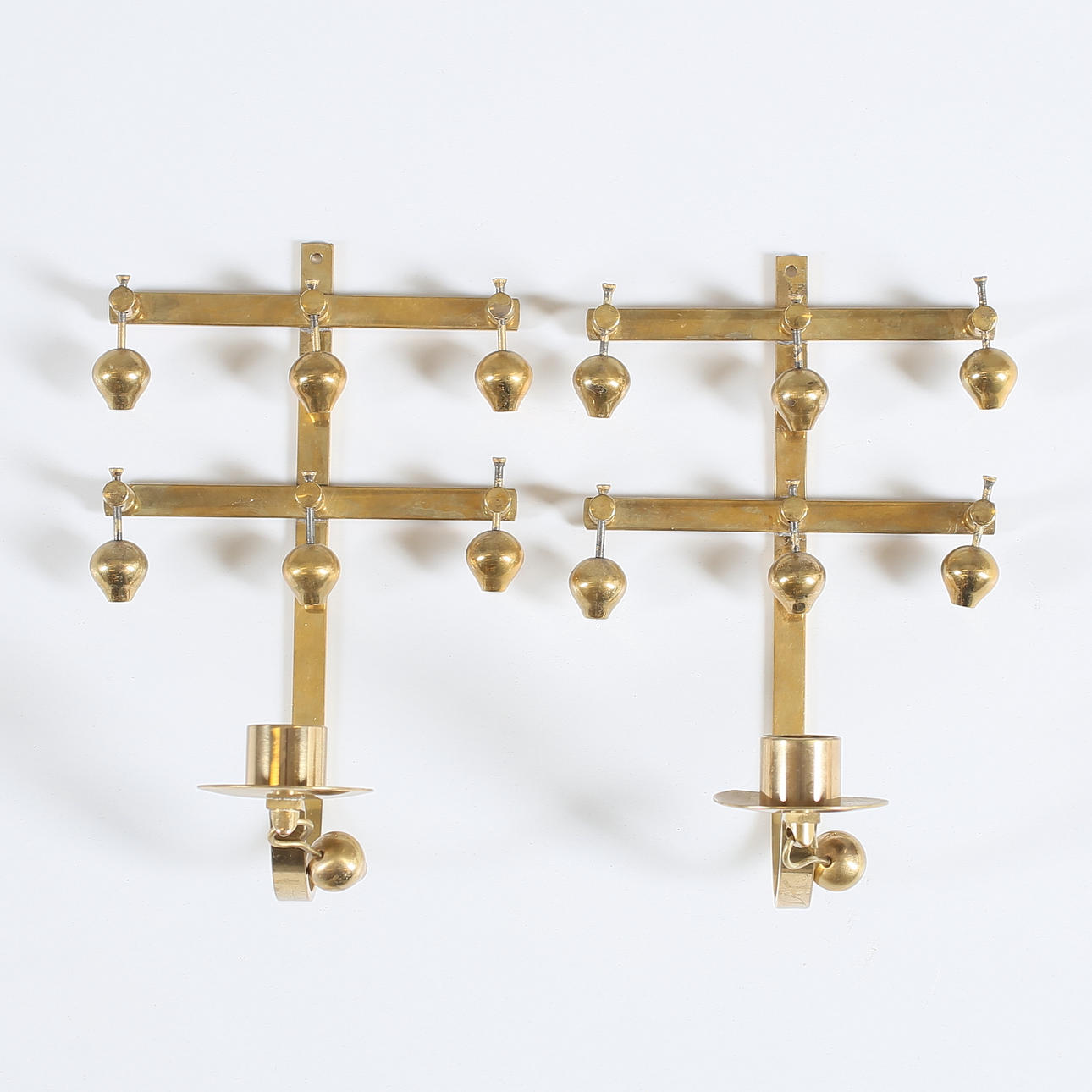 WALL LIGHTS, a pair, brass, marked KEE, Mora.