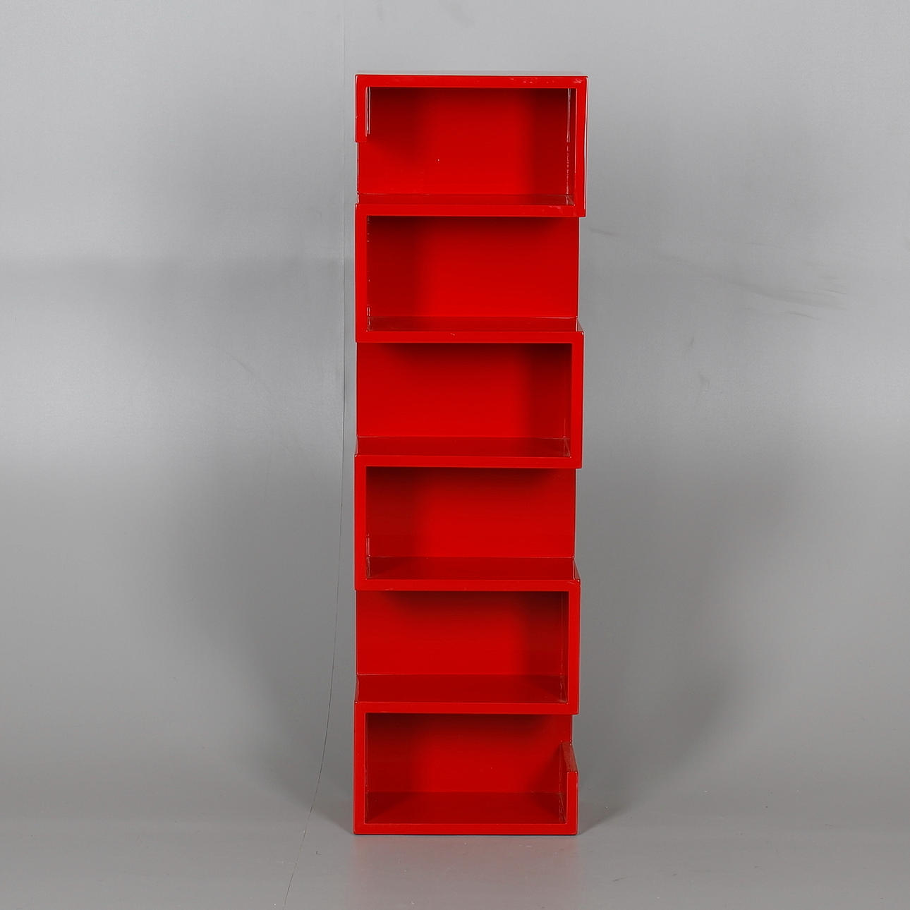 A WALL MOUNTED CD RACK OR SMALL SHELF UNIT.