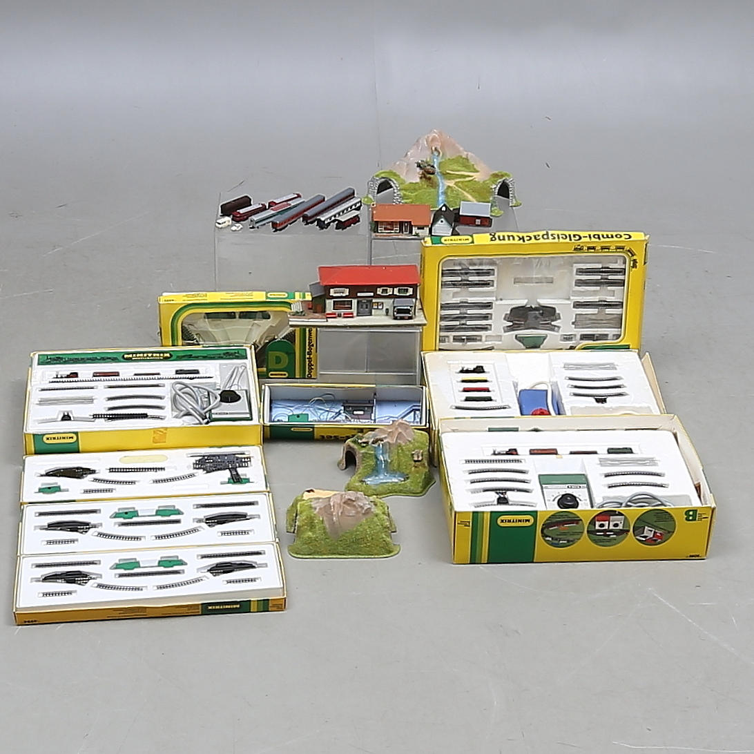 MINITRIX scale N, 3 train sets, a rail coach with trailer, 6 wagons, 6 expansion sets and more.