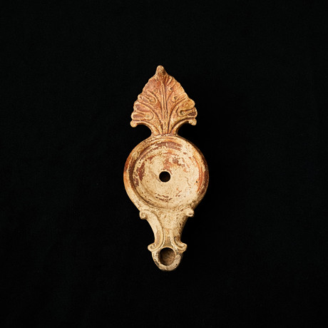 OIL LAMP, Roman, about 0-300 AD, handle in the form of acanthus leaves