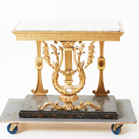A console table, early 19th century, empire, partly cut decoration ...