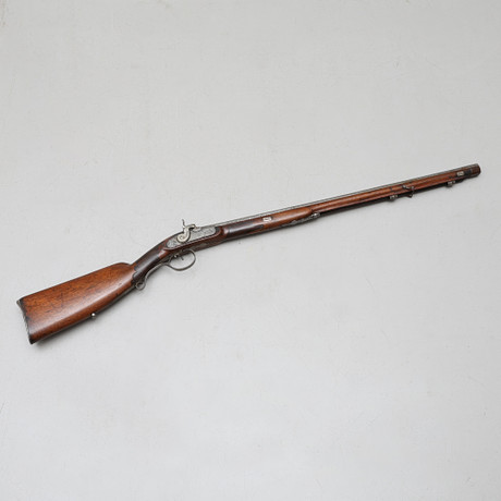 A CONVERTED FLINTLOCK RIFLE, 17TH/19TH CENTURY. Lock signed Schüller ...