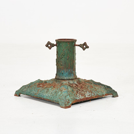 A cast-iron Christmas tree base, cones and roots in relief, first half ...