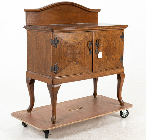 An oak sideboard with copper fittings, early 20th century. Furniture ...