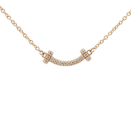 TIFFANY & CO. Tiffany T kollektion, 18kt rosa guld 'Mini T Smile' halsband med 16 briljant