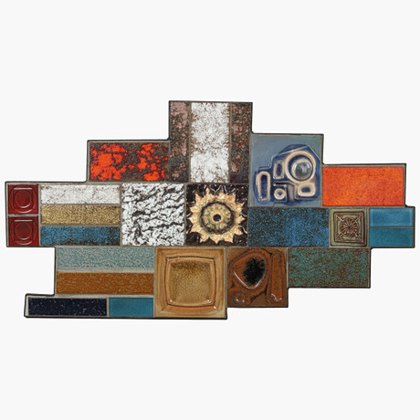 Abstract wall relief of multicoloured ceramics mounted in black iron ...