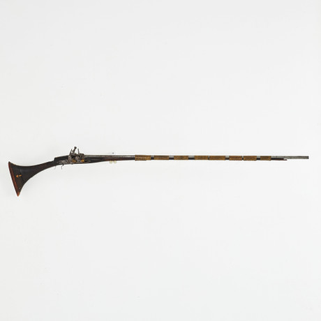 A North African flintlock rifle, 19th century, wooden flask with ...