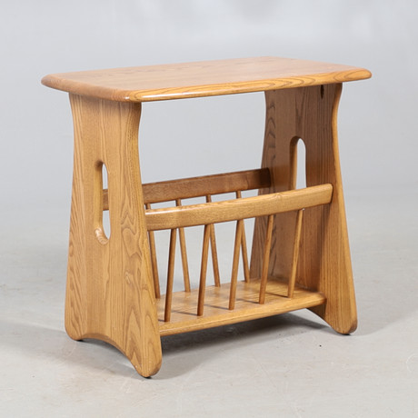 AN ERCOL MAGAZINE RACK. Furniture - Tables - Auctionet