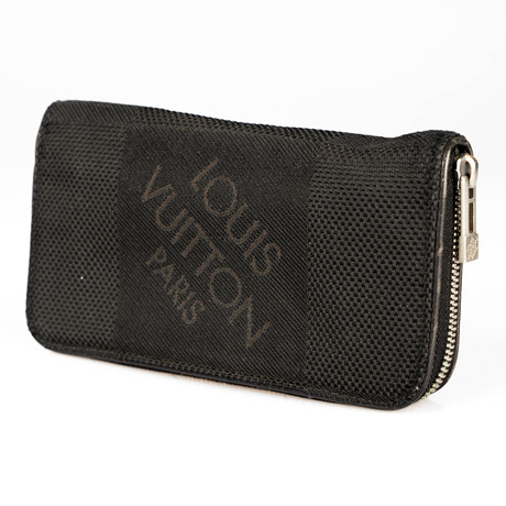 LOUIS VUITTON. Plånbok, "Long zippy wallet black Damier Geant".