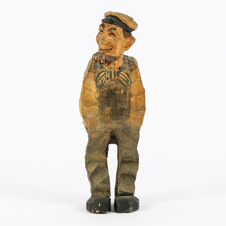 GUNNAR KALLES. The wooden figurine, Woman in folk costume, signed