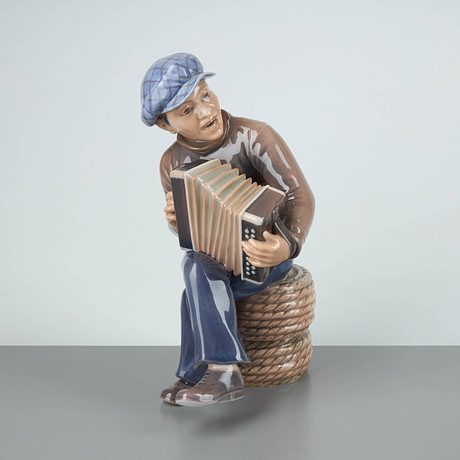 FIGURIN. Dragspelande man, nr 1154. Dahl Jensen. Danmark.