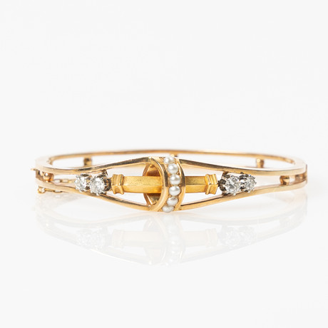 ARMRING, 18K guld med pärlor och gammalslipade diamanter, Gustav Dahlgren & Co, Malmö, 1892. på auktion hos Stockholms Auktionsverk Helsingborg