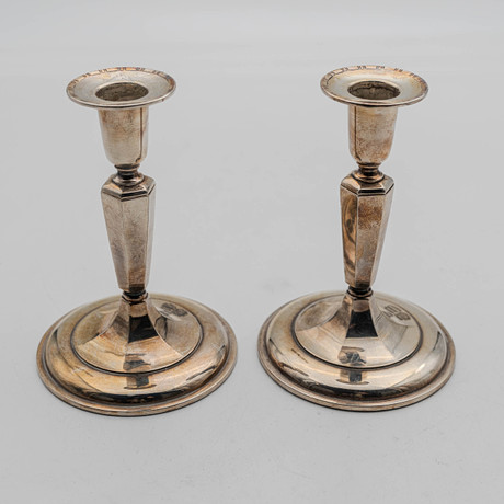 2 st ljusstakar 830, silver. på auktion hos Norrlands Auktionsverk